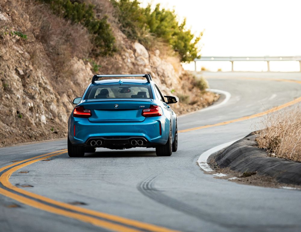 Blue BMW driving on European roads